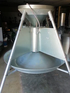 Feed-Smart feeder with galvanized divider panels separating the trough into feeding stations