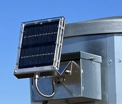 Solar panel and control box on a Feed-Smart feeder hopper